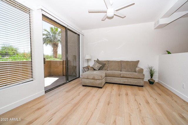 5122 E Shea Blvd Unit 1043, Scottsdale, AZ 85254 - living room with wood finished floors, ceiling fan, and baseboards