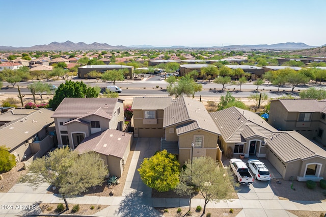 birds eye view of property with a residential view and a mountain view