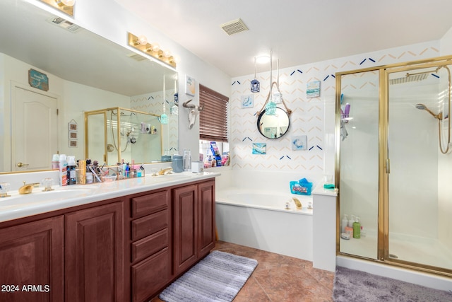 full bath with a garden tub, double vanity, visible vents, a stall shower, and a sink