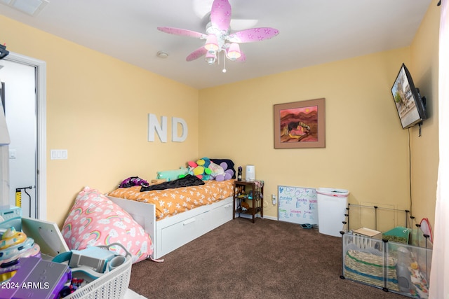 carpeted bedroom with visible vents and a ceiling fan