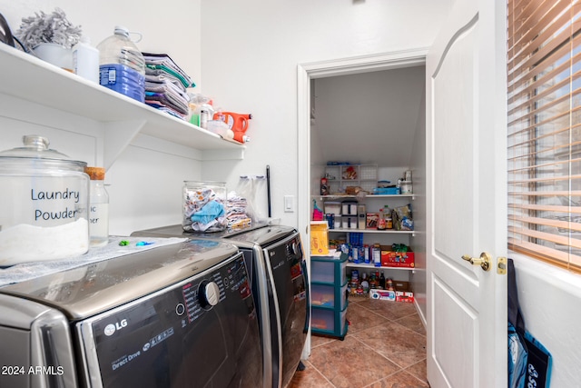 laundry room with laundry area, tile patterned flooring, and washer and dryer