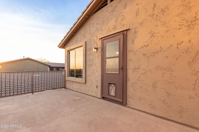 view of side of property featuring a patio area and stucco siding