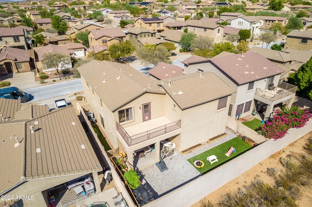 birds eye view of property with a residential view