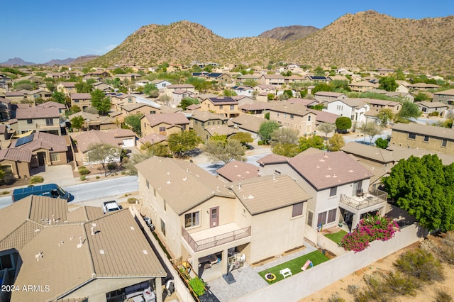 birds eye view of property with a mountain view and a residential view