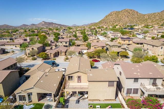 birds eye view of property with a residential view and a mountain view