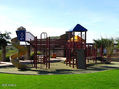 community play area with a lawn