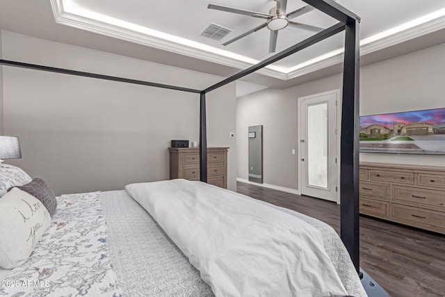 bedroom featuring ceiling fan and dark hardwood / wood-style floors