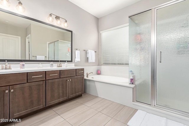 bathroom with independent shower and bath, vanity, and tile patterned flooring