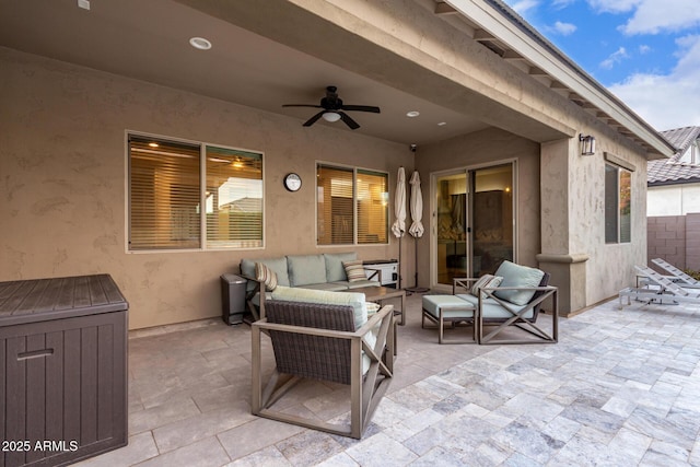 view of patio featuring an outdoor hangout area and ceiling fan