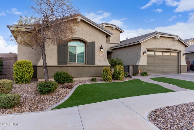 view of front of property featuring a garage and a front yard