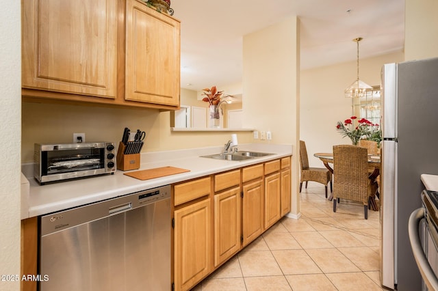 14950 W Mountain View Blvd Unit 7209, Surprise, AZ 85374 - kitchen featuring appliances with stainless steel finishes, a sink, light tile patterned flooring, and light countertops