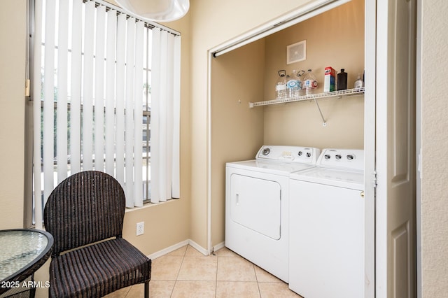 14950 W Mountain View Blvd Unit 7209, Surprise, AZ 85374 - laundry area with washer and dryer, light tile patterned flooring, and baseboards