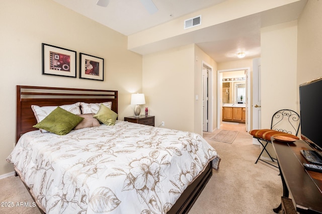 14950 W Mountain View Blvd Unit 7209, Surprise, AZ 85374 - bedroom with light colored carpet, ensuite bath, ceiling fan, and baseboards