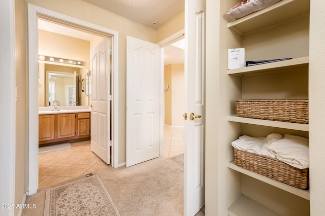 14950 W Mountain View Blvd Unit 7209, Surprise, AZ 85374 - interior space featuring light tile patterned floors, a sink, light carpet, and baseboards