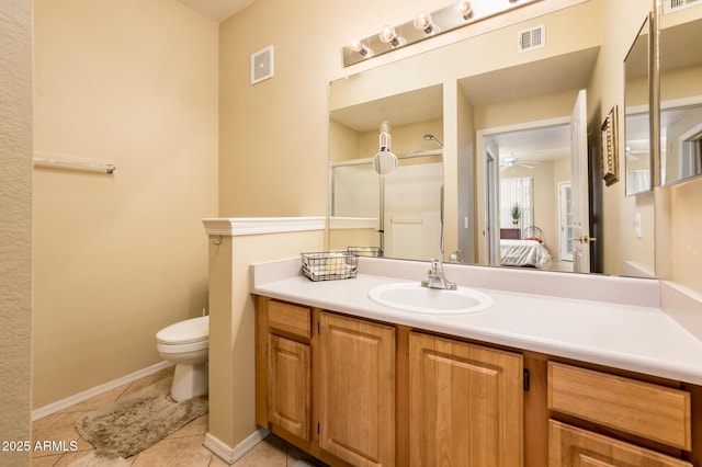 14950 W Mountain View Blvd Unit 7209, Surprise, AZ 85374 - bathroom with vanity, toilet, tile patterned flooring, ceiling fan, and ensuite bathroom