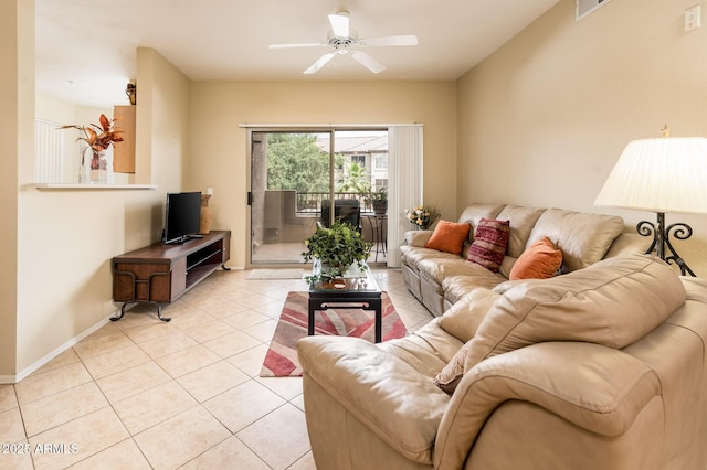 14950 W Mountain View Blvd Unit 7209, Surprise, AZ 85374 - living room featuring light tile patterned floors, ceiling fan, and baseboards