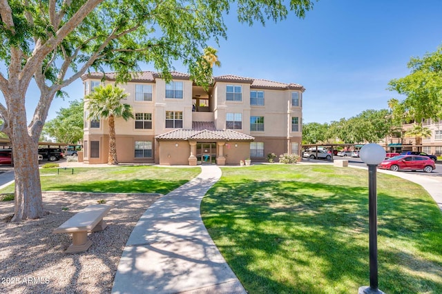 14950 W Mountain View Blvd Unit 7209, Surprise, AZ 85374 - multi unit property featuring stucco siding, a tiled roof, uncovered parking, and a front yard