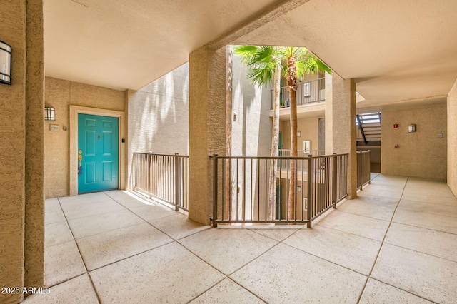 14950 W Mountain View Blvd Unit 7209, Surprise, AZ 85374 - doorway to property featuring stucco siding and a balcony