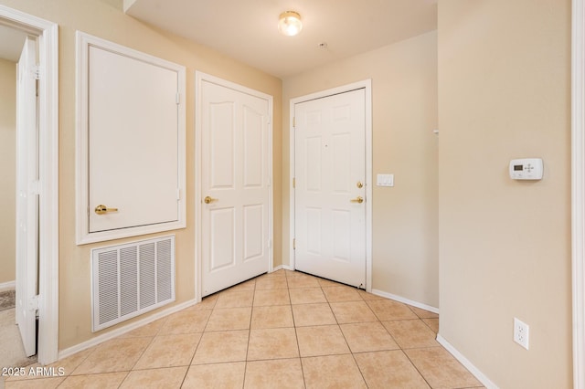 14950 W Mountain View Blvd Unit 7209, Surprise, AZ 85374 - foyer entrance featuring baseboards and light tile patterned flooring