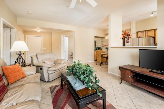 14950 W Mountain View Blvd Unit 7209, Surprise, AZ 85374 - living room featuring light tile patterned flooring, ceiling fan, and baseboards
