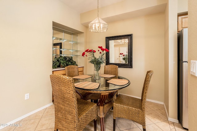 14950 W Mountain View Blvd Unit 7209, Surprise, AZ 85374 - dining space with a chandelier, light tile patterned floors, and baseboards