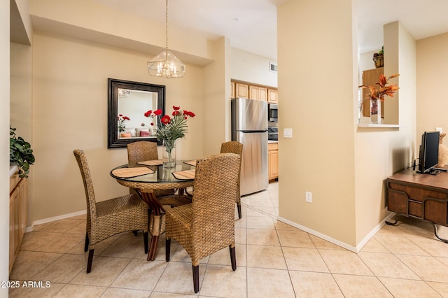 14950 W Mountain View Blvd Unit 7209, Surprise, AZ 85374 - dining room featuring a chandelier, light tile patterned floors, and baseboards