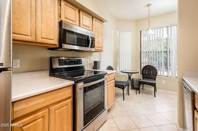 14950 W Mountain View Blvd Unit 7209, Surprise, AZ 85374 - kitchen with appliances with stainless steel finishes, light tile patterned flooring, light countertops, and decorative light fixtures