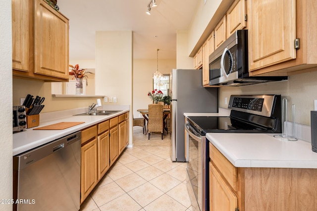 14950 W Mountain View Blvd Unit 7209, Surprise, AZ 85374 - kitchen featuring appliances with stainless steel finishes, a sink, light countertops, light tile patterned flooring, and light brown cabinetry