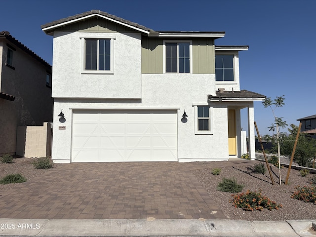 18001 W Lupine Ave, Goodyear, AZ 85338 - view of front of home featuring an attached garage, decorative driveway, and stucco siding