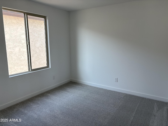 18001 W Lupine Ave, Goodyear, AZ 85338 - unfurnished room featuring healthy amount of natural light, carpet floors, and baseboards