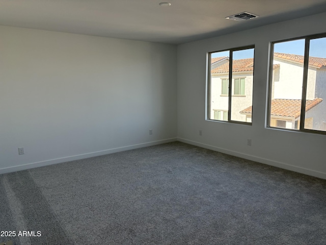 18001 W Lupine Ave, Goodyear, AZ 85338 - carpeted empty room featuring baseboards