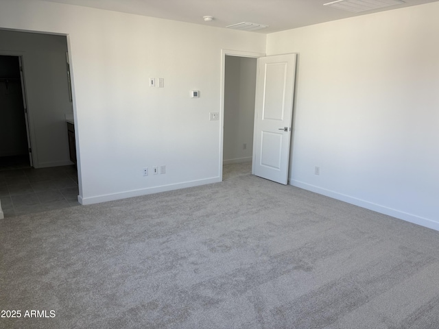 18001 W Lupine Ave, Goodyear, AZ 85338 - carpeted empty room featuring baseboards