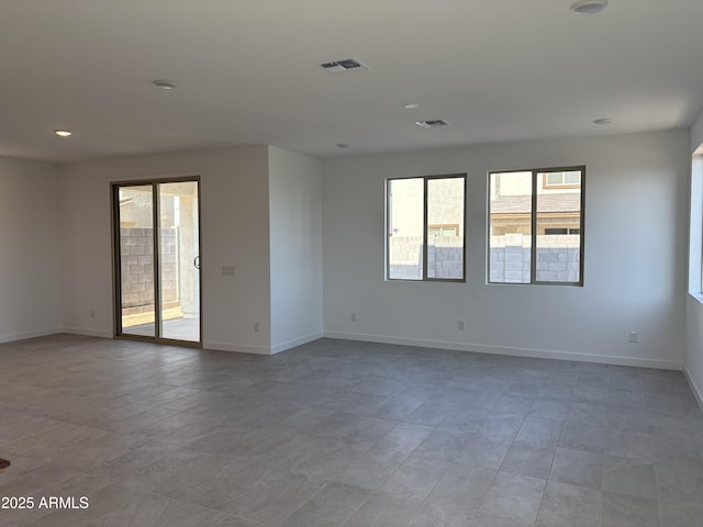 18001 W Lupine Ave, Goodyear, AZ 85338 - unfurnished room featuring plenty of natural light, baseboards, tile patterned flooring, and recessed lighting