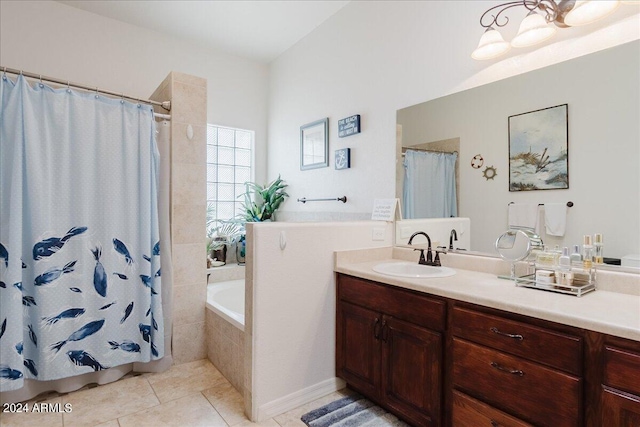 bathroom with tile patterned flooring, shower with separate bathtub, and vanity