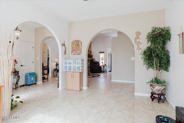 hallway featuring light tile patterned floors