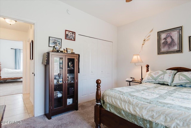 carpeted bedroom with a closet