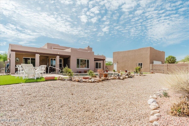 rear view of house featuring a patio