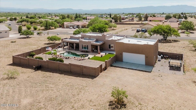 birds eye view of property with a mountain view