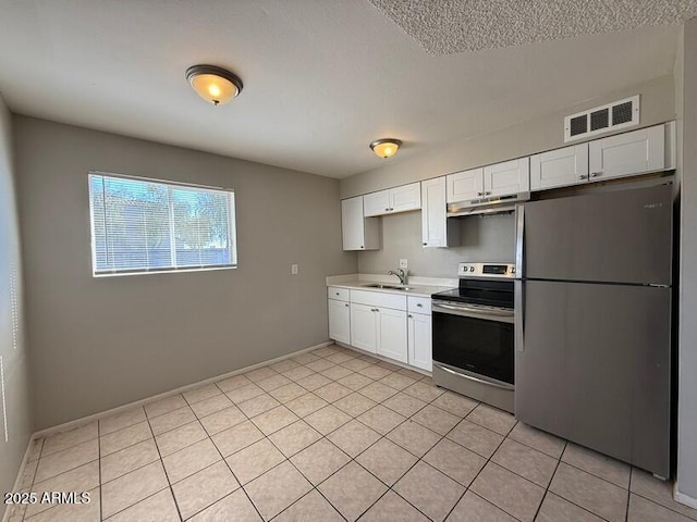 kitchen featuring visible vents, under cabinet range hood, white cabinets, stainless steel appliances, and a sink