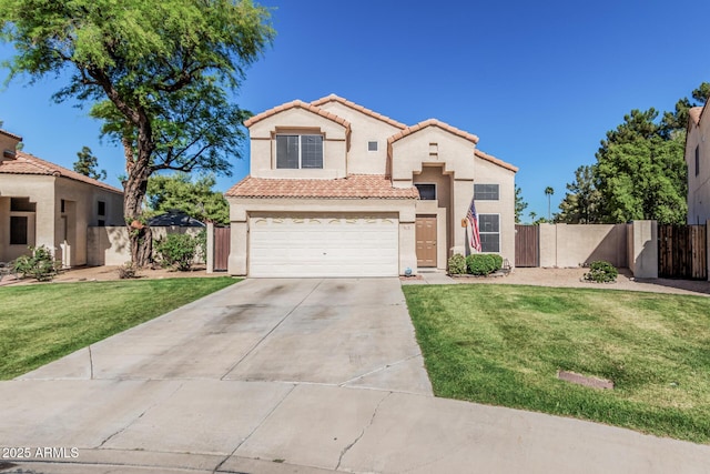 mediterranean / spanish-style house with fence, a tile roof, a front yard, a gate, and concrete driveway