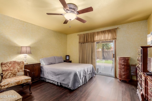 bedroom featuring ceiling fan, dark wood finished floors, and access to exterior