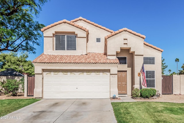 mediterranean / spanish house featuring fence, stucco siding, a gate, concrete driveway, and a tile roof