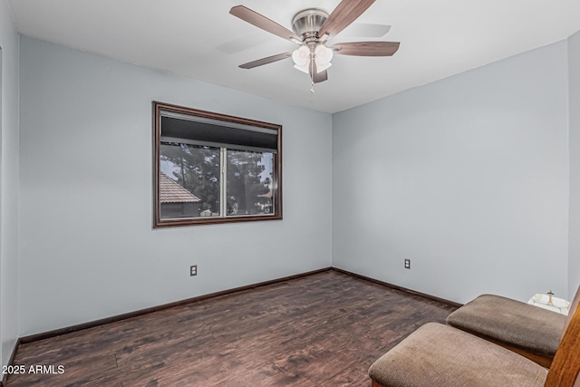 interior space with baseboards, ceiling fan, and wood finished floors