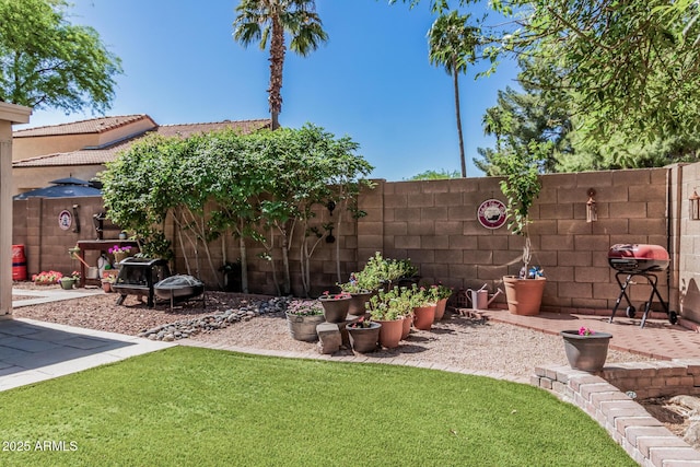 view of yard with fence and a patio area