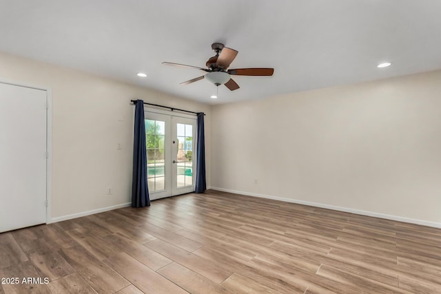 unfurnished room with a ceiling fan, baseboards, recessed lighting, and light wood-style flooring