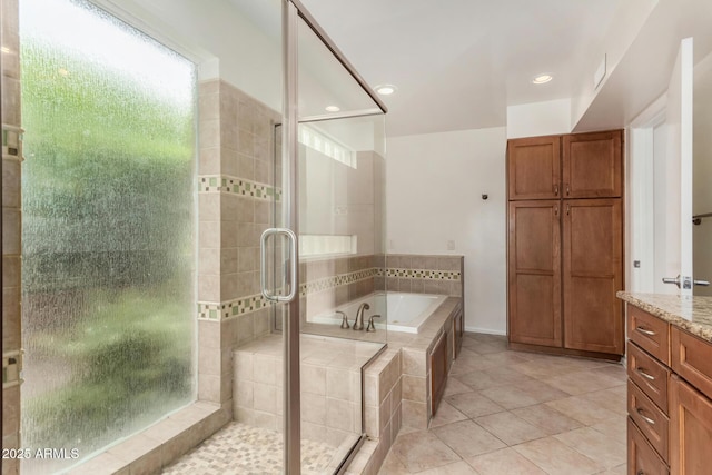 full bathroom with tile patterned flooring, vanity, recessed lighting, a shower stall, and a garden tub