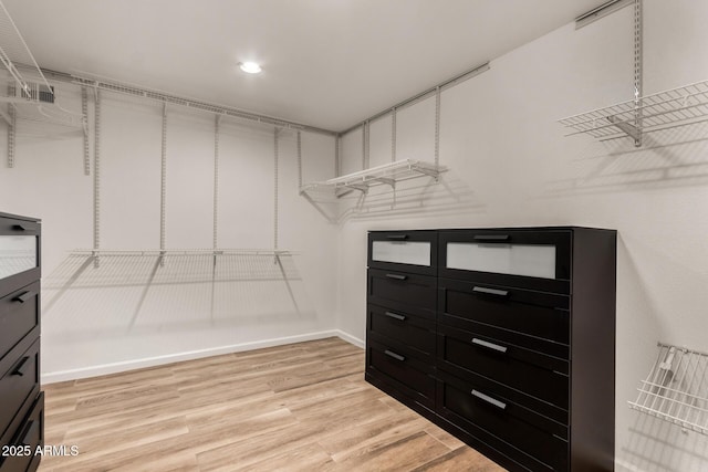 walk in closet featuring light wood-type flooring