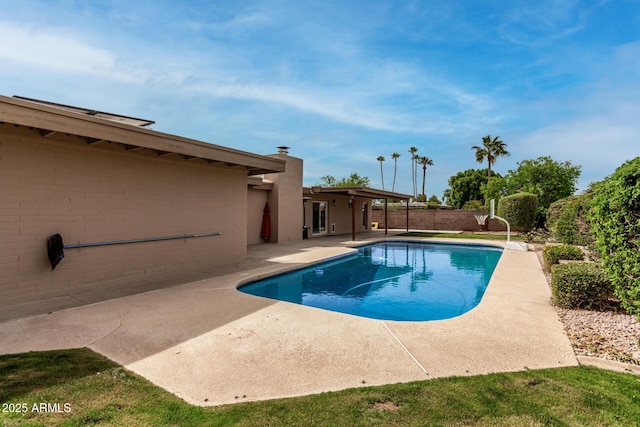 view of pool with a fenced in pool, a fenced backyard, and a patio area