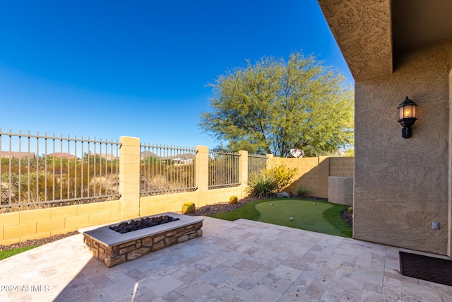 view of patio / terrace with a fire pit