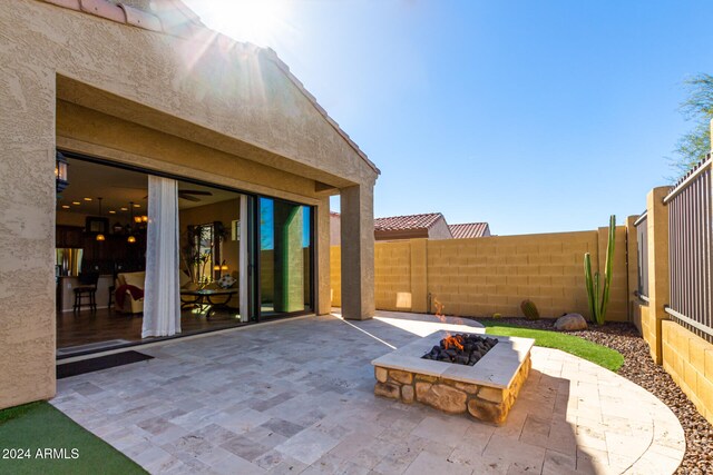 view of patio / terrace with an outdoor fire pit